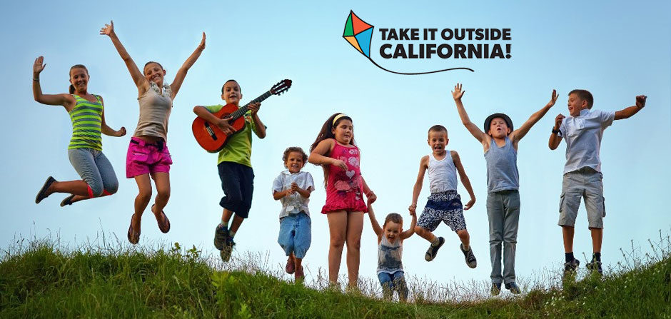 Children Jumping Outside with Take It Outside California logo above in the sky